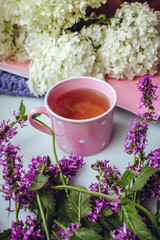 Cup of tea flowers bouquet morning