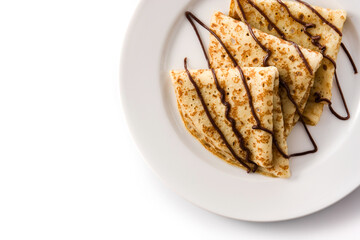 Sweet crepes with chocolate isolated on white background. Top view. Copy space