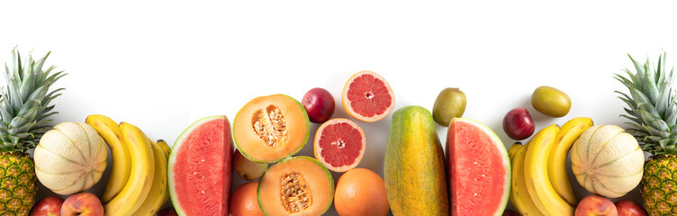 Fototapeta na wymiar Variety of fresh seasonal fruits on white background, panoramic view, copy space