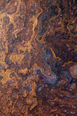 Macro detail of a beautiful abstract painting of mixed paint flowing randomly, in purple color tones with gold and sparkles and visible canvas texture. Could be used as print design.   