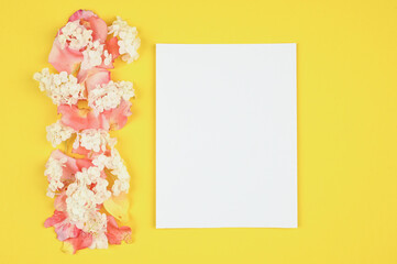 Blank card with white and pik flowers petals.