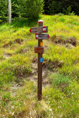 Signpost on the Muraglione Pass, a pass in the Tuscan-Emilian Apennines in the province of Florence, Tuscany, Italy, on the path of the Gothic Line and the path of the Sacred Forests.