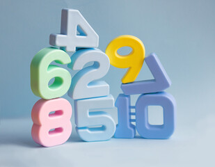 pyramid of plastic volumetric figures blue background