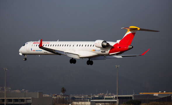 BARCELONA, SPAIN - JANUARY 24, 2020: View of modern jet airliner Bombardier CRJ1000 of Iberia Regional Airlines during final approaching to runway at El Prat Airport