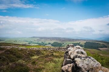 mountain landscape with blue sky and wall