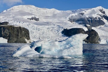 Antarctic iceberg landscape, glacier running into ocean, mountains, Antarctica