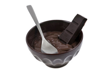 Ramekin of chocolate cream with squares of chocolate close-up on white background