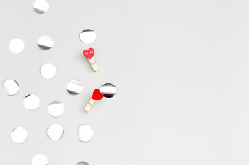 Silver round confetti on the gray texture