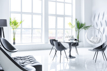 Luxurious futuristic trendy modern interior in contrasting black and white colors with interesting fashionable black furniture and decorated wall