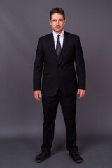 Portrait of handsome bearded businessman in suit