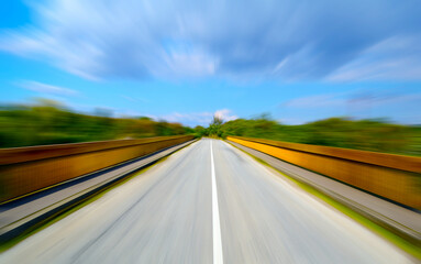 Driving on the road, motion blur effect. Empty asphalt road in motion blur