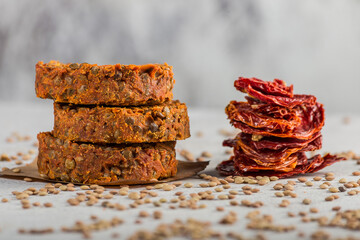 Lentil chickpea tomato burgers on a light background. selective focus