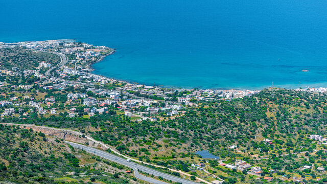 Top view from the mountains to the village of Malia, roads and the nearby villages of the field and the Aegean Sea. Crete, Greece