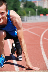 Adaptive runner at the start line on track