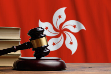 Justice and court concept in Hong Kong . Judge hammer on a flag background