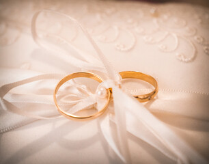 Gold tied wedding rings of bride and groom the wedding day