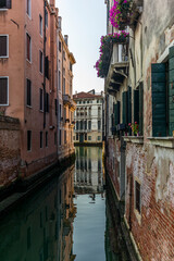 View of the  water channels, bridges and old palaces in Venice at sunrise during the lockdown