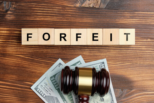 forfeit concept as an inscription on a sticker next to the judge's hammer