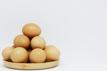eggs in a wooden plate