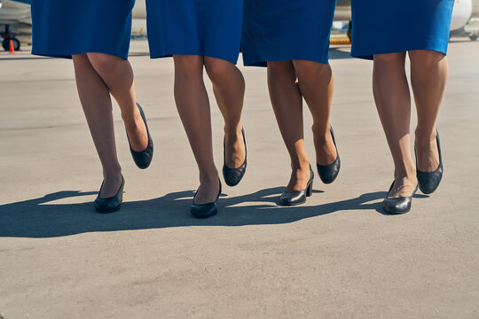 Female flight attendants wearing elegant court shoes