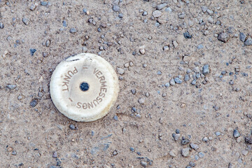 German point in a dirt road, Vermessungspunkt means measurement point for road works