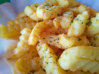 Spicy fast food: French fries with cheddar cheese, chili and chicken fillet close-up on a plate. horizontal view from above
