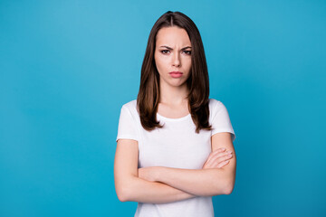 Fototapeta premium Photo of attractive business lady hold arms hands crossed worker intelligent person bad mood boss fired her dismissal concept wear casual white t-shirt isolated blue color background