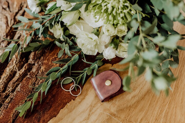 wedding rings, wedding rings and bouquet in one composition, ring box, wedding day, close-up