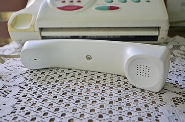 Hold out ear phone from the base to stop incoming calls