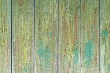 Fototapeta na wymiar Wood texture. A fragment of an old wooden fence close-up.
