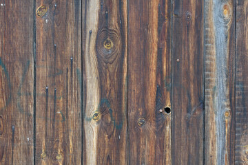 Wood texture. A fragment of an old wooden fence close-up.