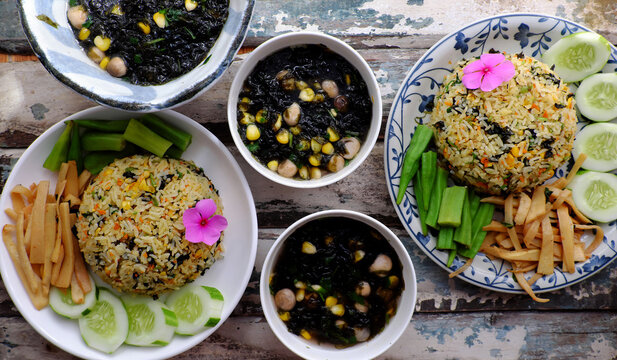 two plate of fried rice dish with vegetables, seaweed soup for family meal at lunch