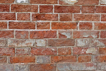 The brick texture. A fragment of brickwork close-up.