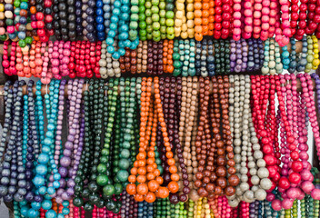 Many colorful new wooden jewelry with balls close