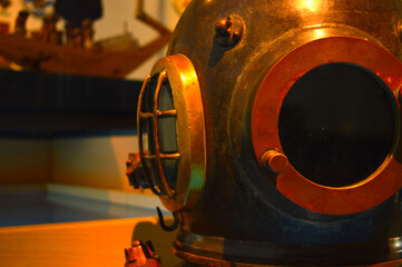 brass mariners helmet with some parts in focus