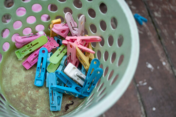 Plastic clothes pins in the bucket Plastic clothes pin in the bucket
