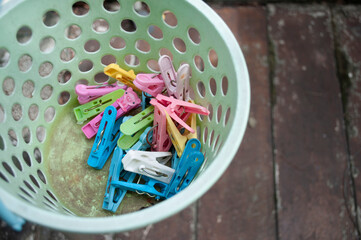Plastic clothes pins in the bucket Plastic clothes pin in the bucket