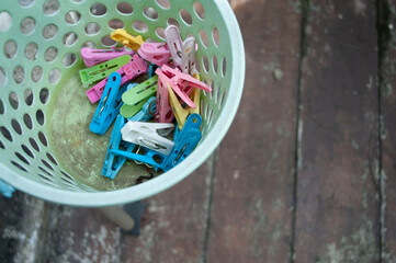 Plastic clothes pins in the bucket Plastic clothes pin in the bucket