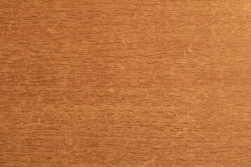 The texture of light brown wood is covered with varnish