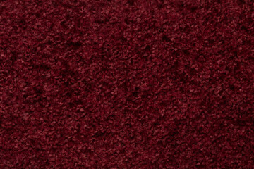 Close - up of the texture of a red woolen product