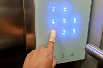 hand pushing a button