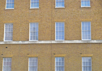 Windows on a victorian building forming a pattern