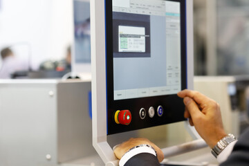 engineer using industrial touchscreen computer - obrazy, fototapety, plakaty