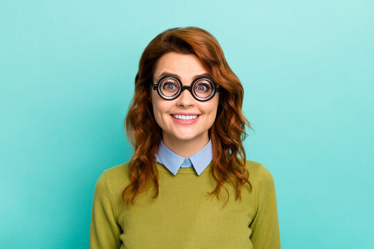 Close-up portrait of her she nice attractive cheerful cheery funny wavy-haired girl wearing thick glasses casual formal-wear isolated on bright vivid shine vibrant teal turquoise color background