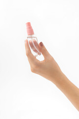 Hand holding alcohol-based sanitizer spray as hygiene measure against coronavirus. Covid-19