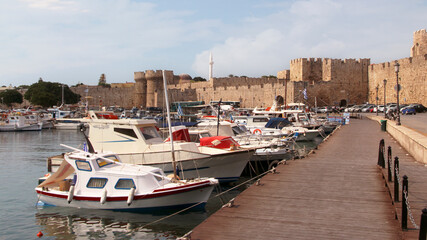 Rhodes, embankment and boats in Mandraki harbour, Rhodes, Greece