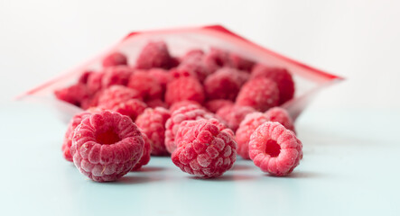 Frozen raspberries from a zip lock freezer bag.