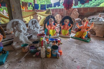 Local artisans preparing idol of God Ganesha/Lord Ganesh from eco friendly clay before the Hindu...