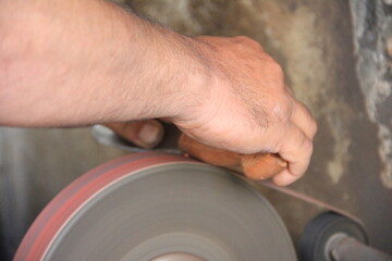 Sparks grinding wheel while knife sharpening