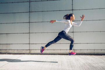 Athletic woman training in the urban area.